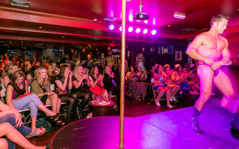 A man about to take his clothes off at Adonic Cabaret