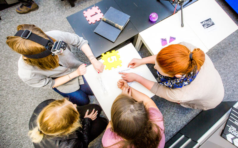 Some girls doing an escape room in Newcastle
