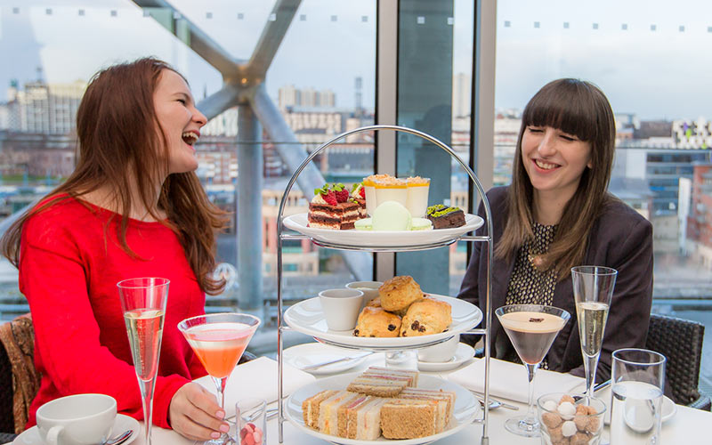 Two girls in The Baltic having afternoon tea