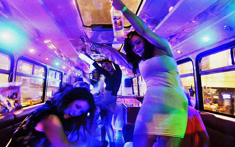 Some drunk women on a party bus