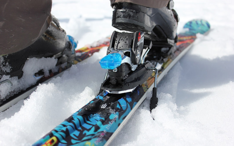 A close up of a pair of skis in the snow