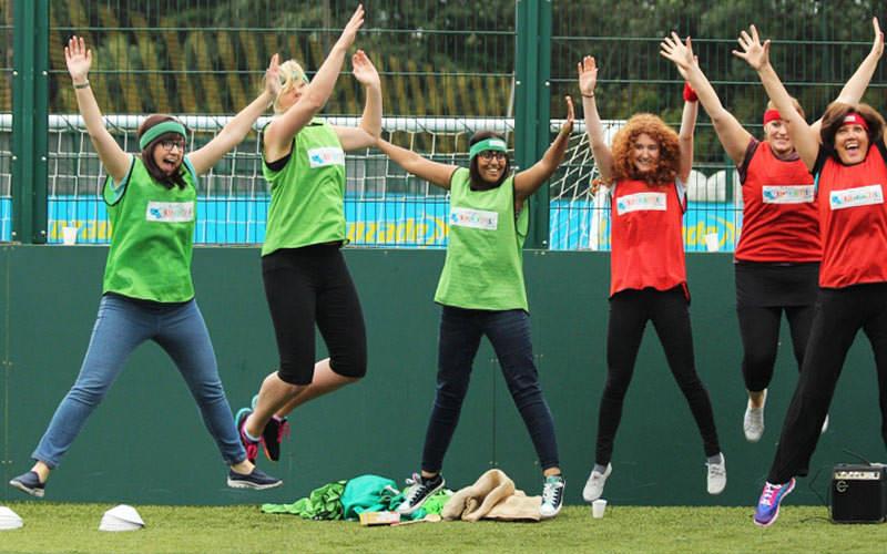 A group of women jumping on a pitch