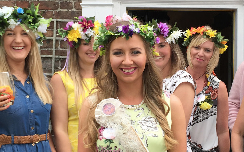 A group of women wearing flower headbands