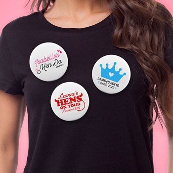 A model wearing three personalised badges.