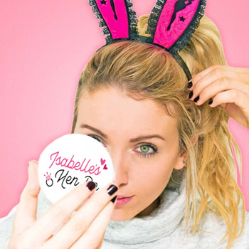 A model looking into a mirror which has personalised on the back.