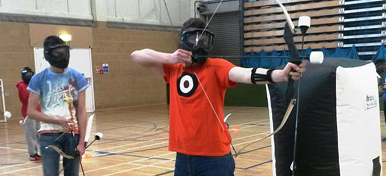 A man using a bow and arrow