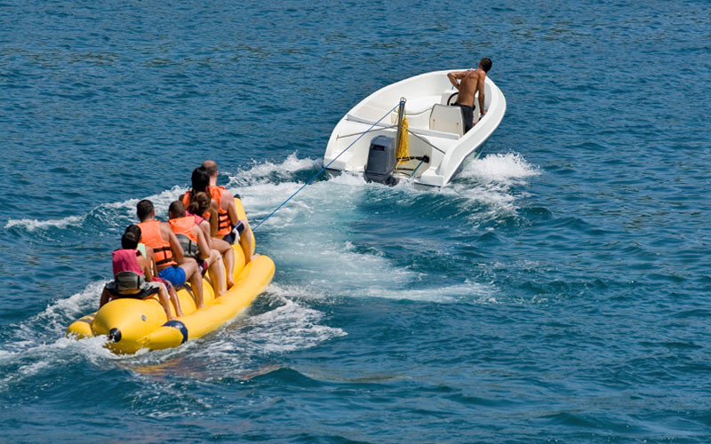 Some people on a banana boat in the Algarve