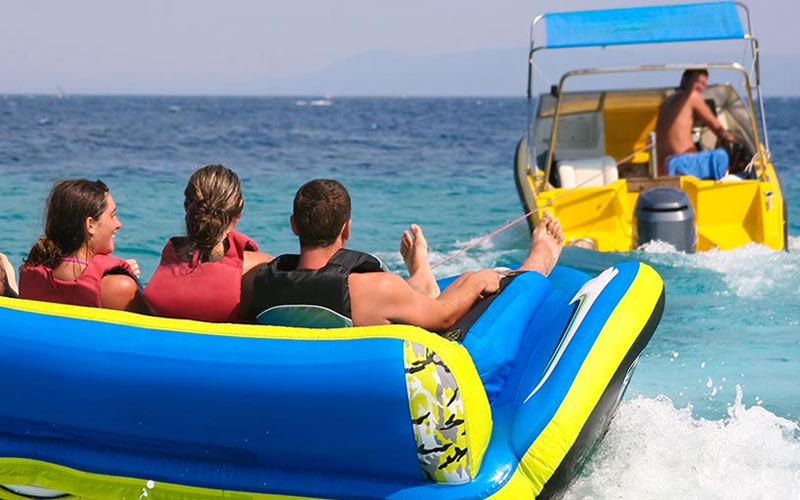 Three people on a banana boat in Barcelona