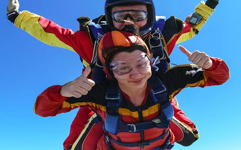 A girl skydiving with an instructor