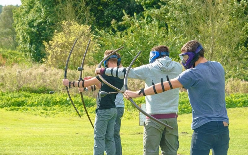 Some people doing archery in Bath
