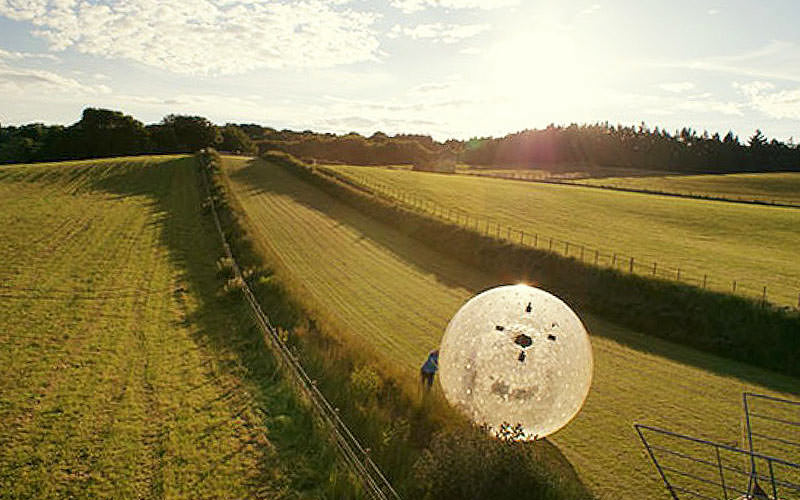 Someone in a zorb on a stag do in Belfast