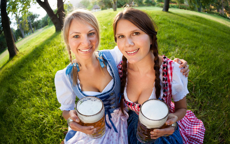 Two women in Bavarian beer maid outfits