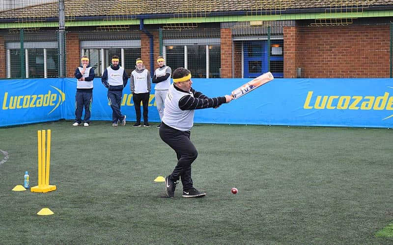 A man playing quick cricket