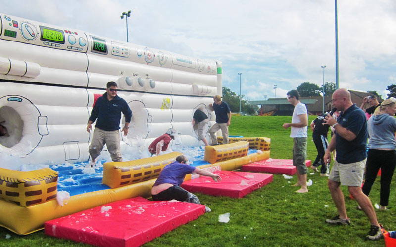 Some people playing inflatable games in Bournemouth