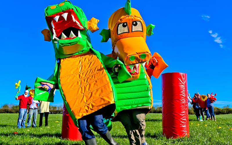 Some people dressed up as Welsh dragons