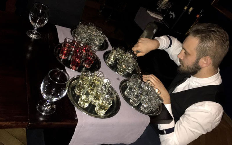 A man pouring shots in Krakow