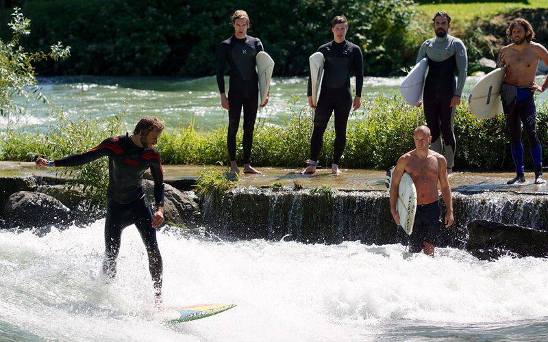 Some men having a surfing lesson
