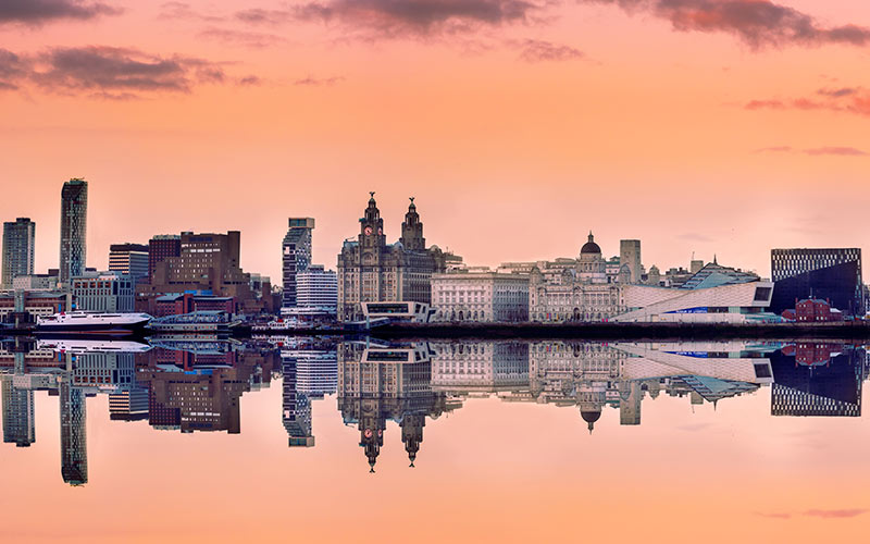 Some buildings reflecting in the water in Liverpool