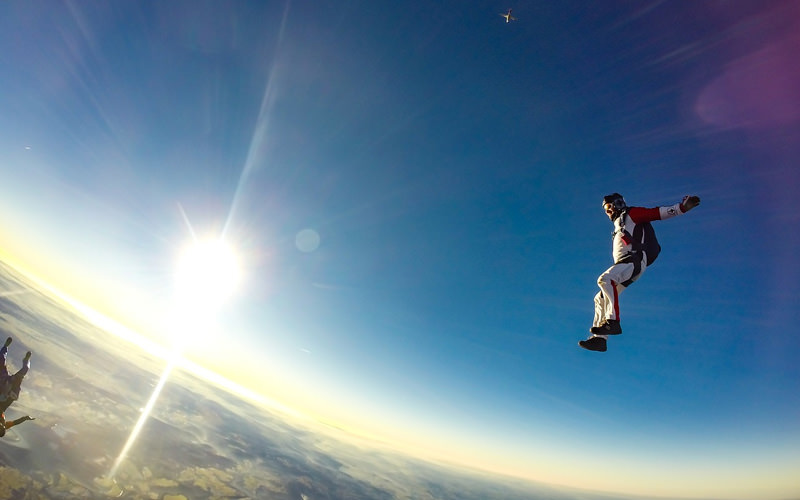Two people jumping out of a plane
