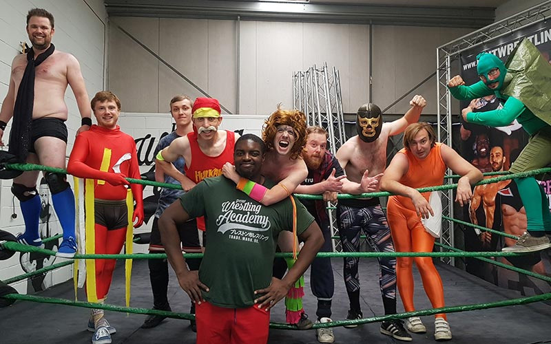 Some stags dressed up in Manchester, at a wrestling course