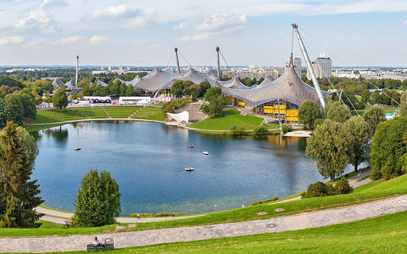 A lake in front of a stadium