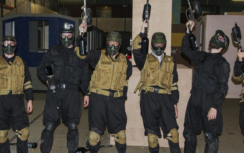 Some men holding guns