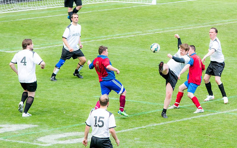 A group of men playing football at St James Park