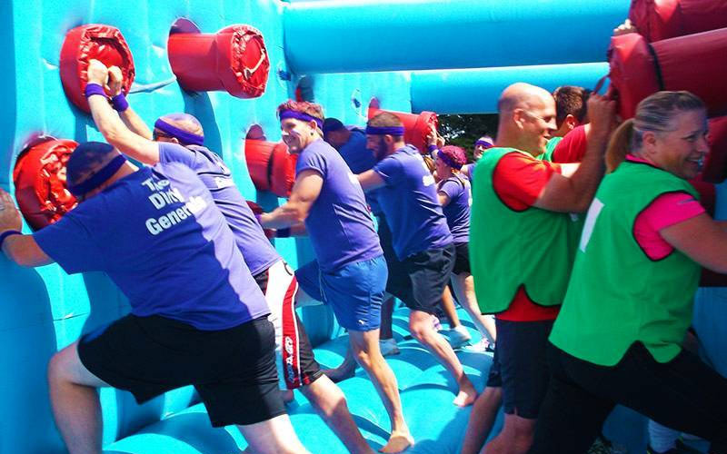 Some men on an inflatables course