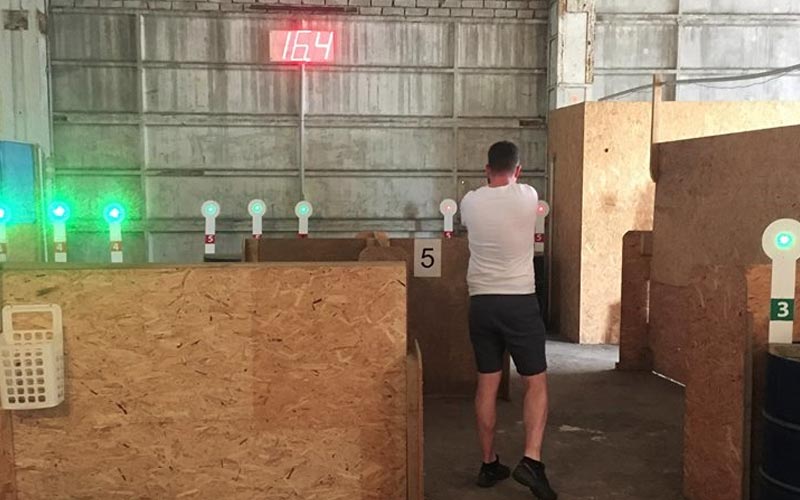  A man shooting a laser at a target