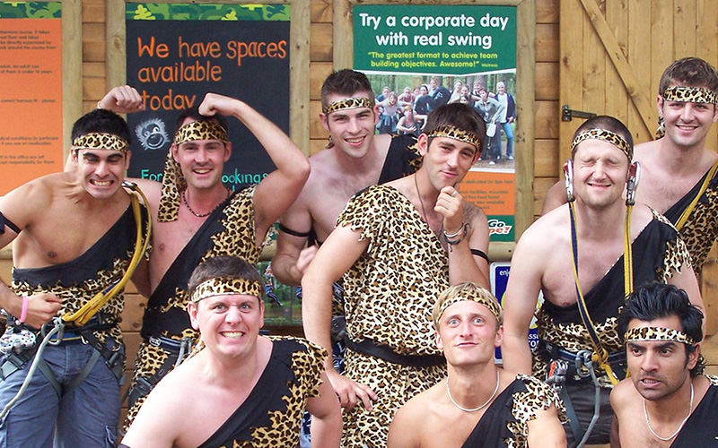 A group of men dressed up in caveman suits