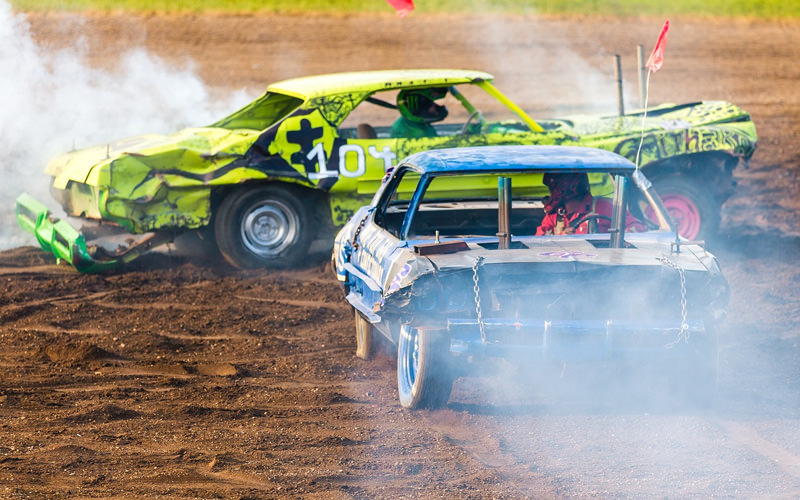 Two vehicles on a dirt track