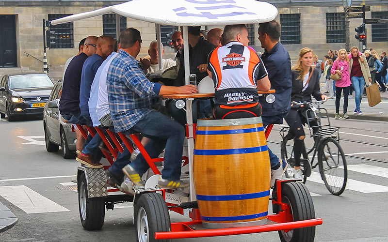 A group of men on a beer bike