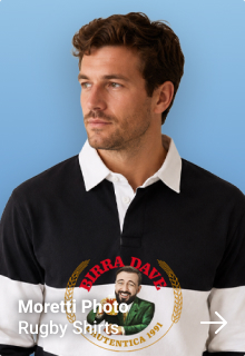 A male model wearing a custom white retro shimmer footie shirt which has been personalised with a Welsh themed badge design with the custom text Welsh Warriors