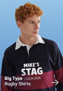 A male model in a black football ref uniform with a pink whistle giving a red card to another male model who is wearing a custom footie top reading team stag