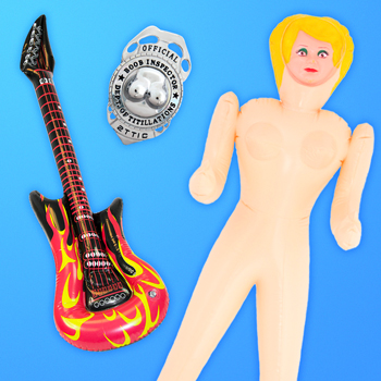 A model wearing some funny head wear and also an inflatable banana.