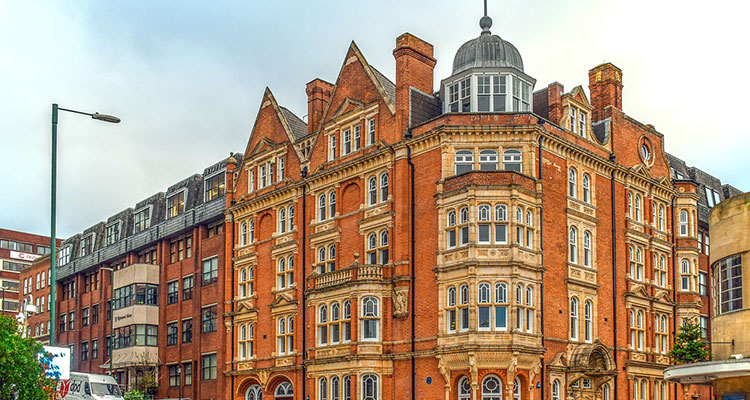 A grand-looking sandstone coloured building. 