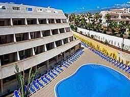 Exterior of Las Piramides, with an outdoor pool in the foreground