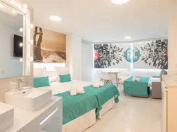 A room with two double beds and a single pull out bed at Benidorm Celebrations Pool Party Resort