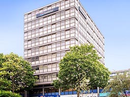 The exterior of Travelodge Nottingham Central with trees outside