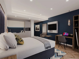 Bed in a room at Roomzzz Edinburgh