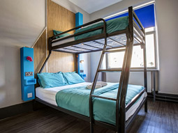 A bunkbed with two double beds at Kick Ass Greyfriars in Edinburgh
