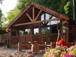A room with wooden bunkbeds and a window to the right at Lodges at The Creek