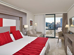 A king room with a balcony that overlooks the city at Melia Benidorm in Benidorm