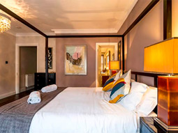 A modern double room with wall art 