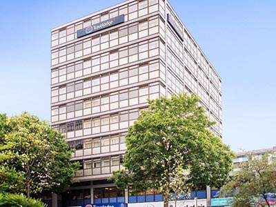 The exterior of Travelodge Nottingham Central with trees outside