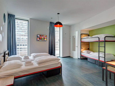  A spacious room with single beds and bunk beds at Meininger Amsterdam Amstel