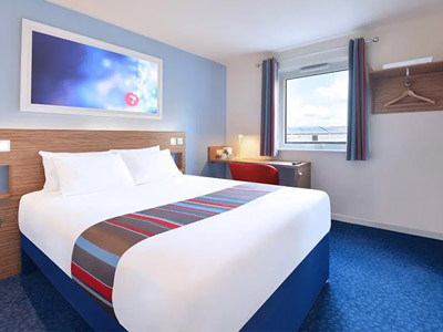 A double bed in a room at Travelodge York Central Layerthorpe