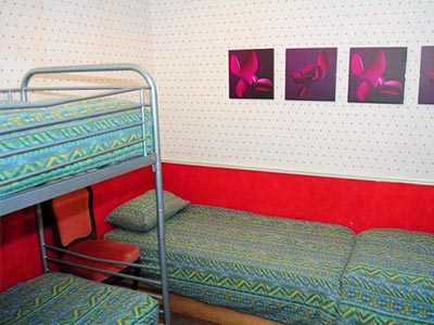 A guest bedroom at Victoria Hotel