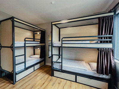 A room with two bunkbeds sleeping four at Snoozles Forster Street