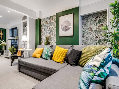 Gorgeous plant-themed living room with corner sofa 